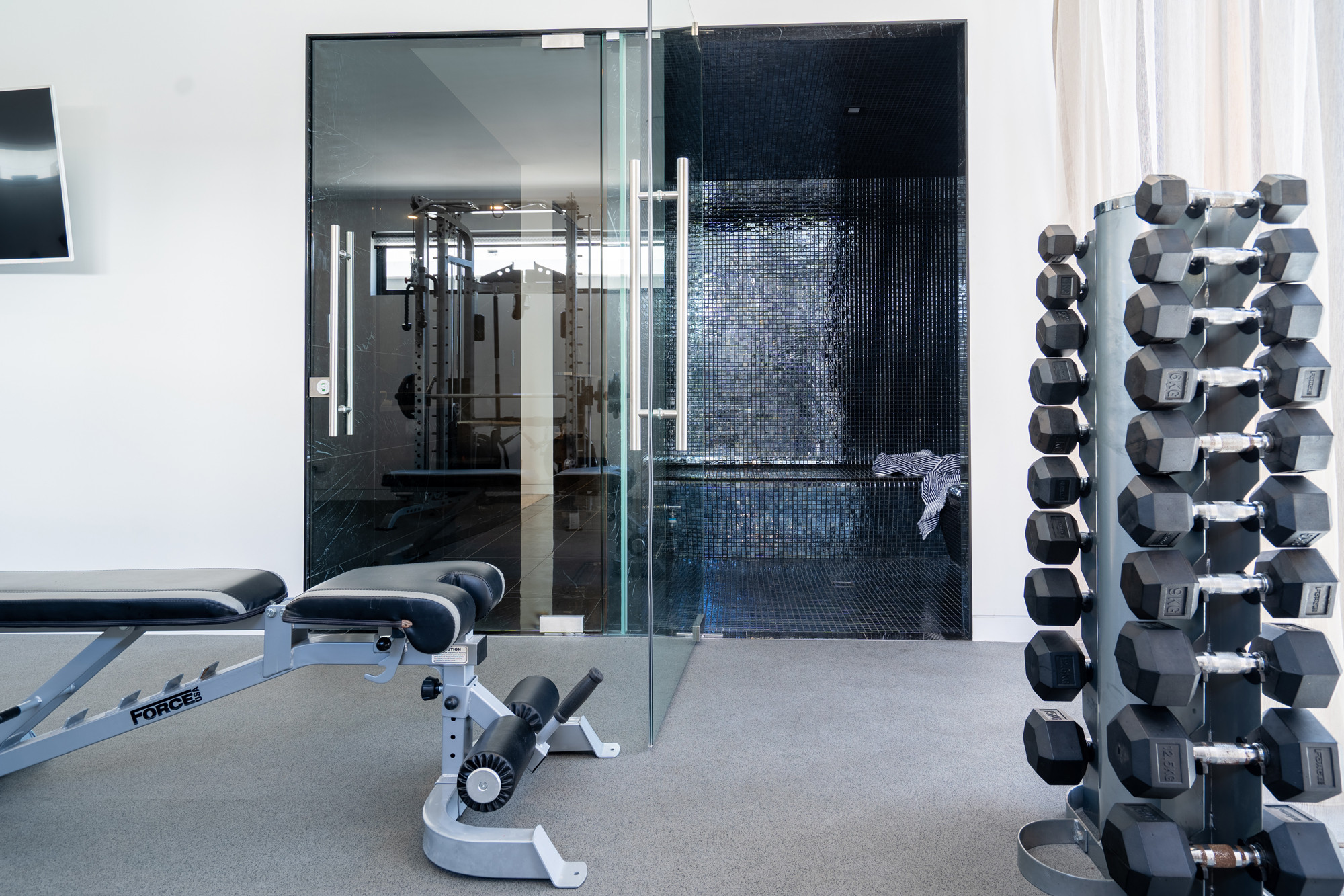 Private gym and tiled steam room